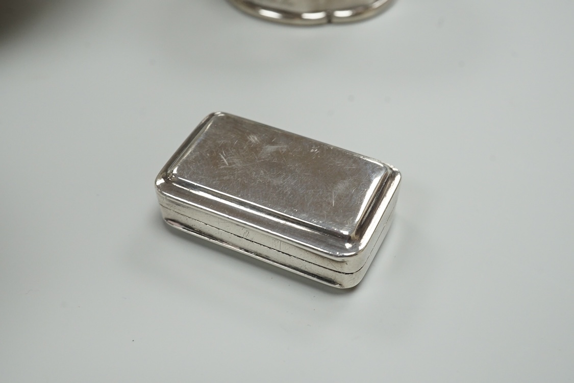 A late Victorian repousse silver navette shaped dish, by Charles Edwards, London, 1894, 25.7cm, with engraved monogram and date, together with a pair of mid 18th century silver sugar nips, an early 19th century silver vi